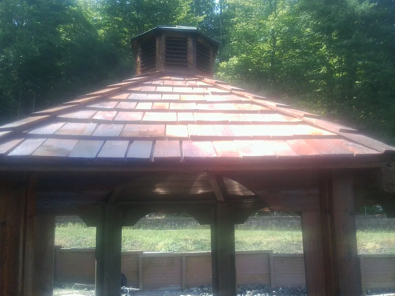 New cedar shake roof and cupola on a lakeside gazebo in Old Monroe